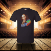 Black t-shirt of Bob Marley on stage with seats and lights in the background.