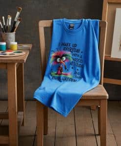 Funny bird in a too large overcoat. He has a long nose and very frizzy colored hair and large eyes.