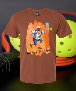 Funny Grandpa Pickleball T-Shirt! This hilarious tee features an artistic impression of an elderly man adding a humorous touch to your favorite sport.